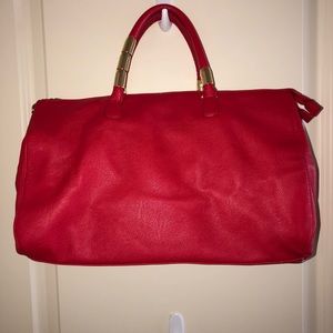 Purse with adjustable strap.